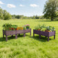 Dwellcozy 2 plastic raised garden beds with plants on a grassy field.