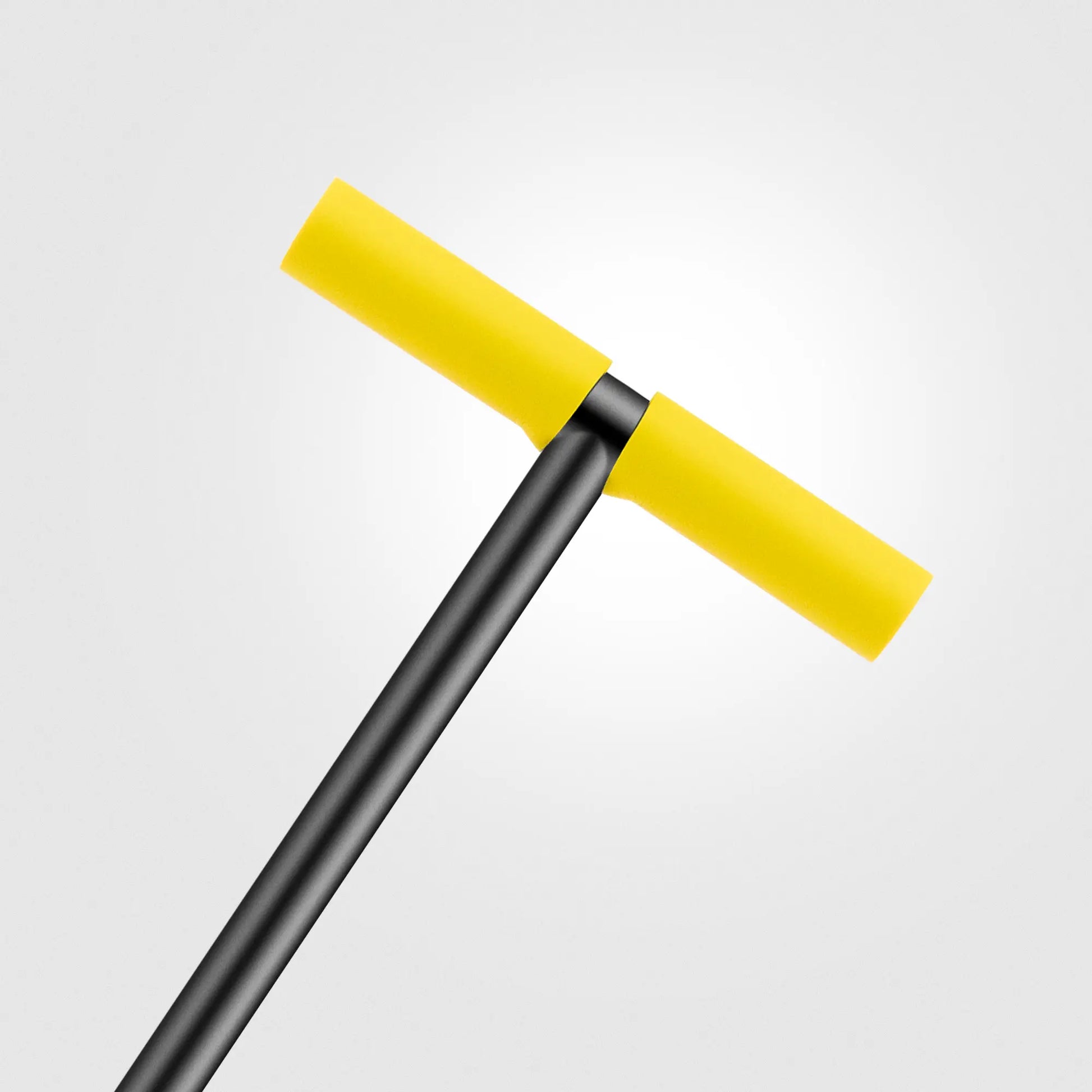 Yellow squeegee on a gray background