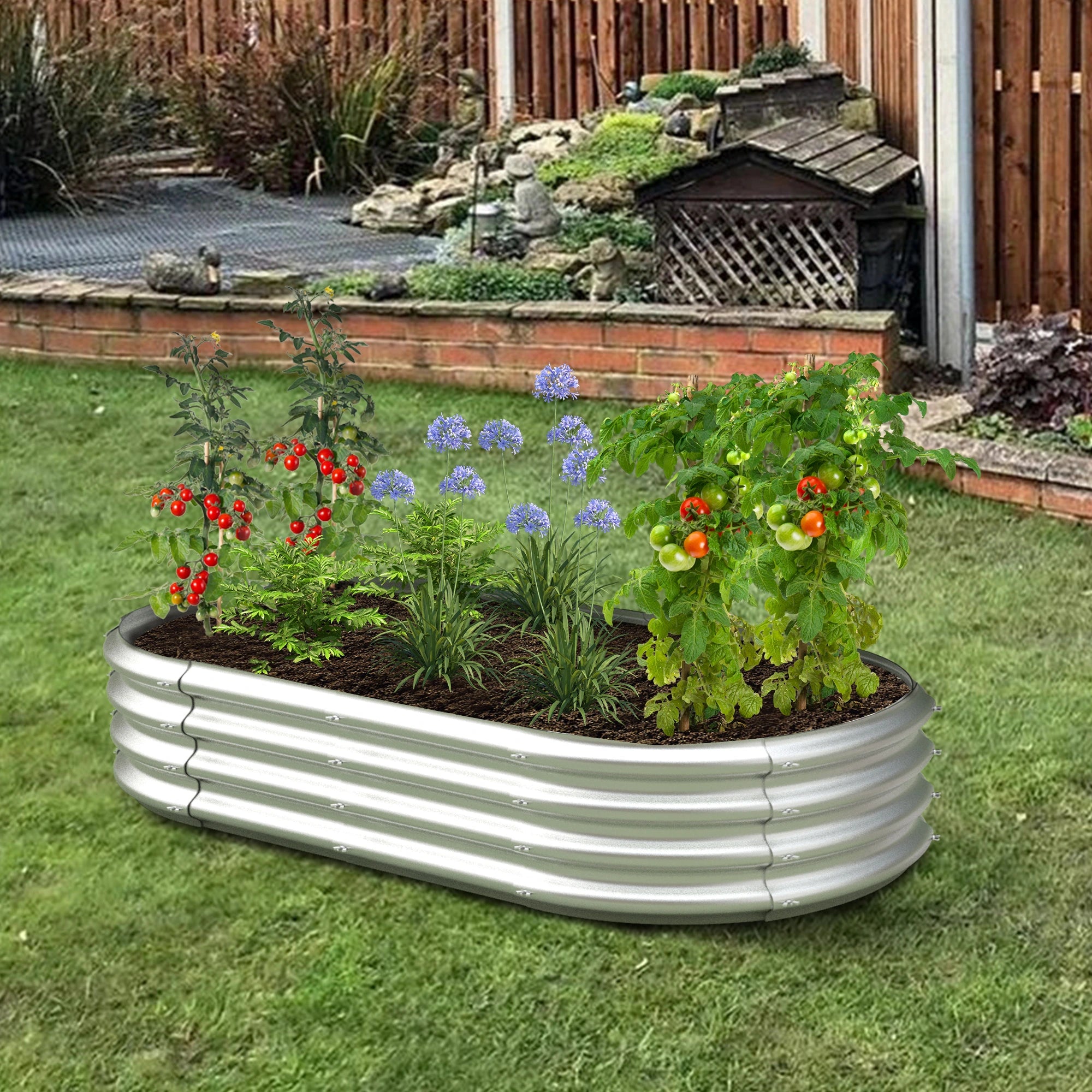 Dwellcozy Metal raised garden bed with plants and flowers in the backyard.