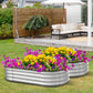 Dwellcozy metal flower beds with colorful flowers in a garden setting with a wooden fence and outdoor furniture.