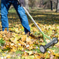 Using a Dwellcozy rolling thatch rake for Lawns to gather leaves.