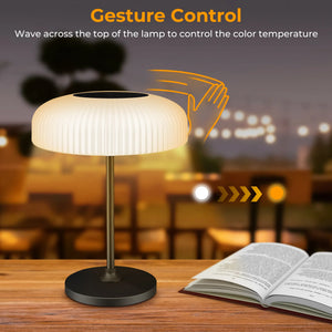 Dwellcozy solar outdoor table lamp wave across the top of the lamp to control the color temperature.